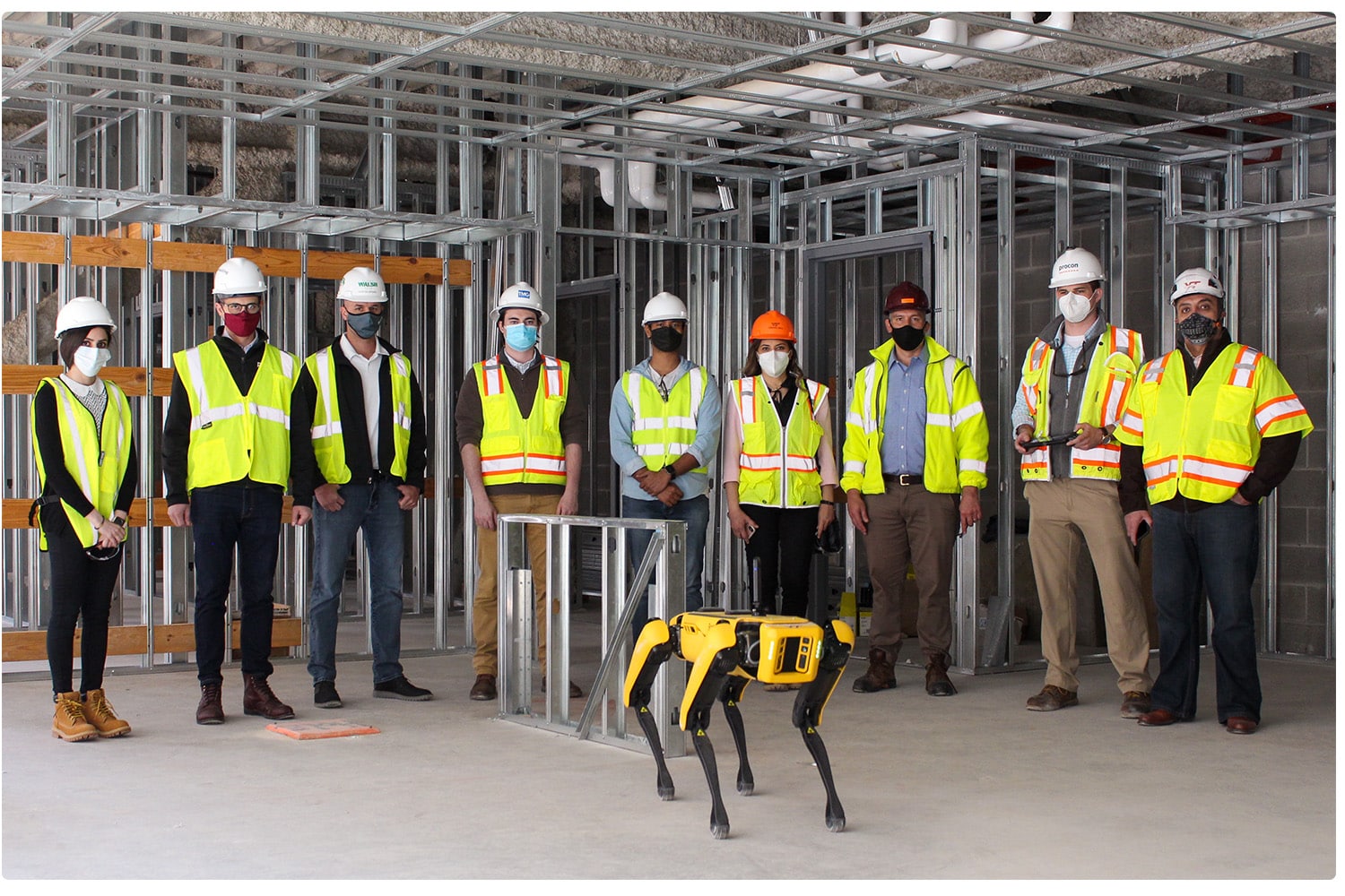 Spot poses with the Virginia Tech research team